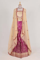 Beautiful satinlehenga adorned with intricate embroidery Paired with a contrast chiffon shawl