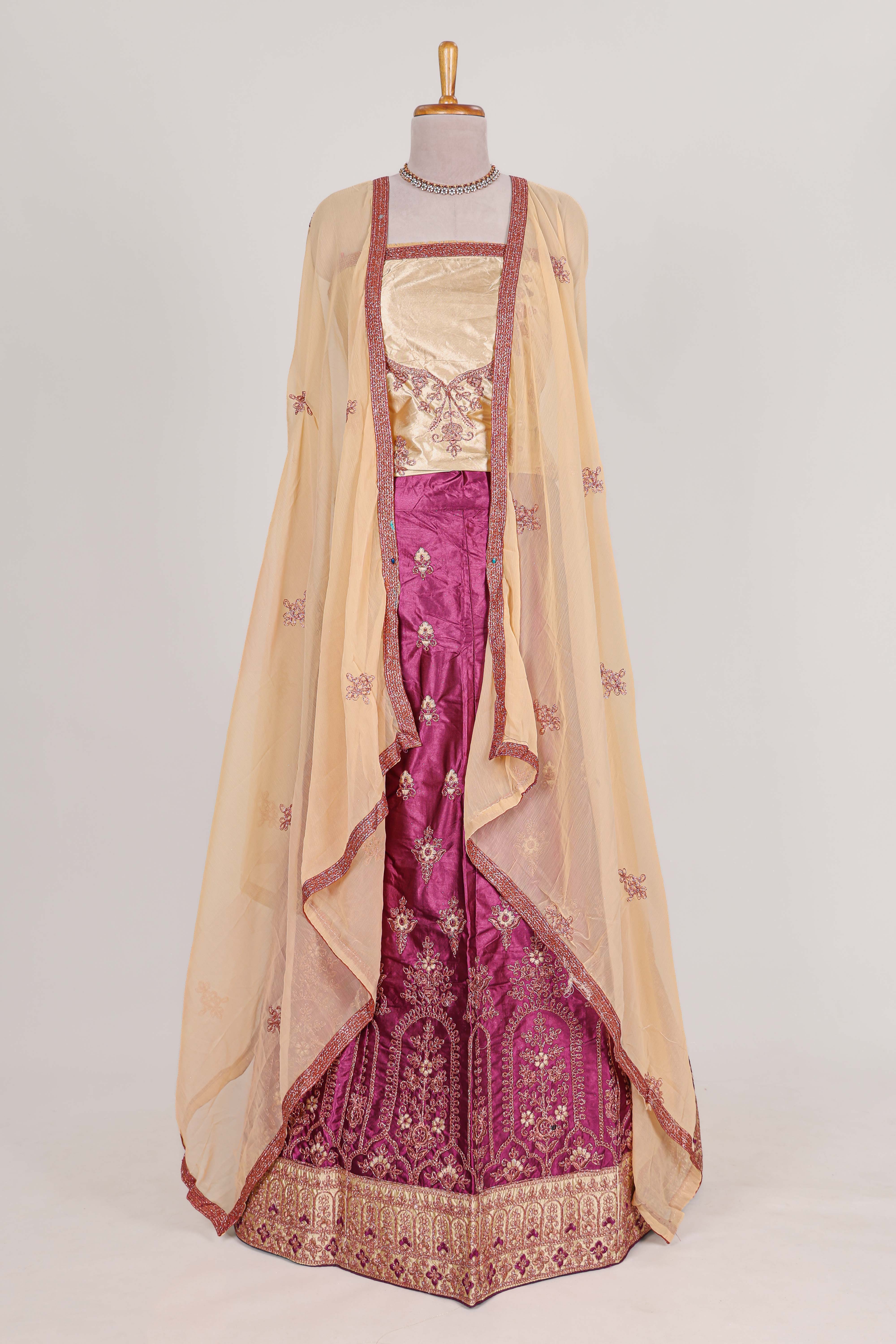 Beautiful satinlehenga adorned with intricate embroidery Paired with a contrast chiffon shawl