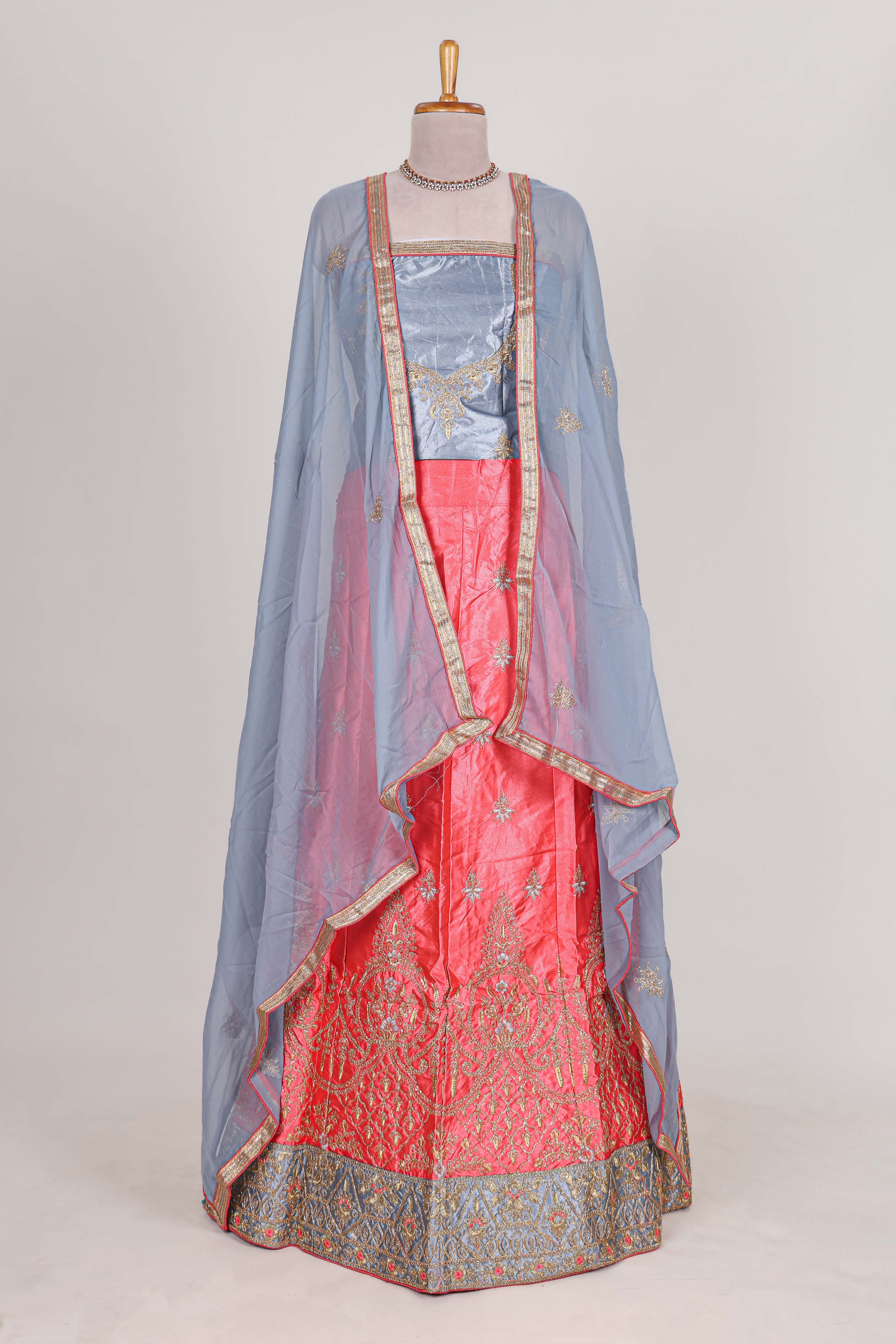 Bright pink satin lehenga embroidery with a beautiful contrast border paired with a matching embroidered blouse