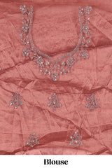 Brown net lehenga intricate embroidery andpaired with a matching embroidered blouse