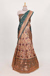Green tissue lehenga featuring intricate thread weaving details with a beautiful contrast border Paired with a brocadeshawl