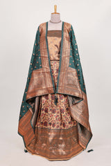 Green tissue lehenga featuring intricate thread weaving details with a beautiful contrast border Paired with a brocadeshawl