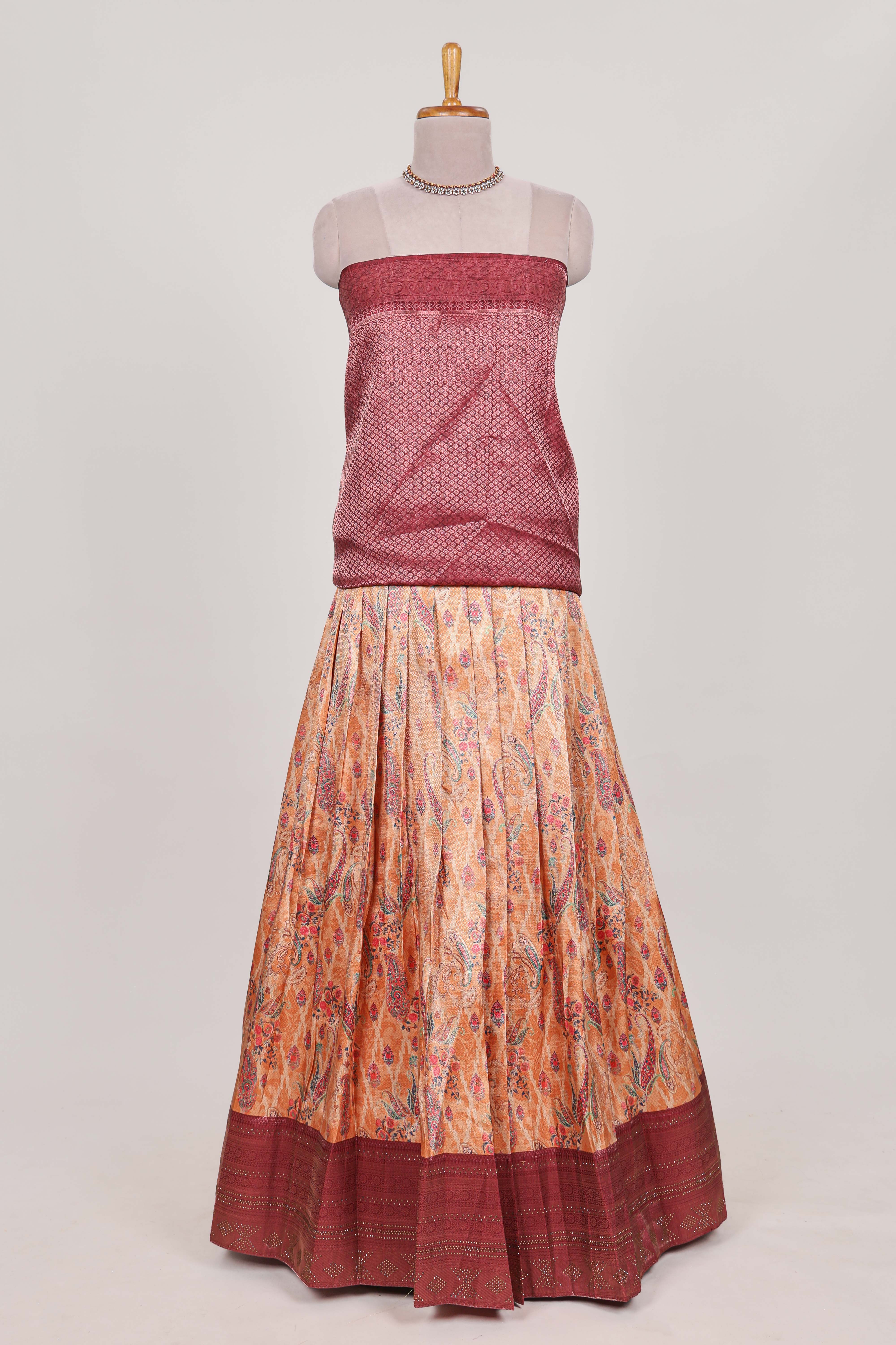 Rani pink tissue lehenga featuring intricate thread weaving details with a beautiful contrast border Paired with a brocadeshawl