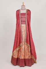 Rani pink tissue lehenga featuring intricate thread weaving details with a beautiful contrast border Paired with a brocadeshawl