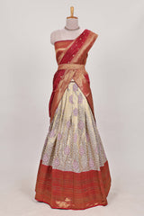 Red tissue lehenga featuring intricate thread weaving details with a beautiful contrast border Paired with a brocadeshawl