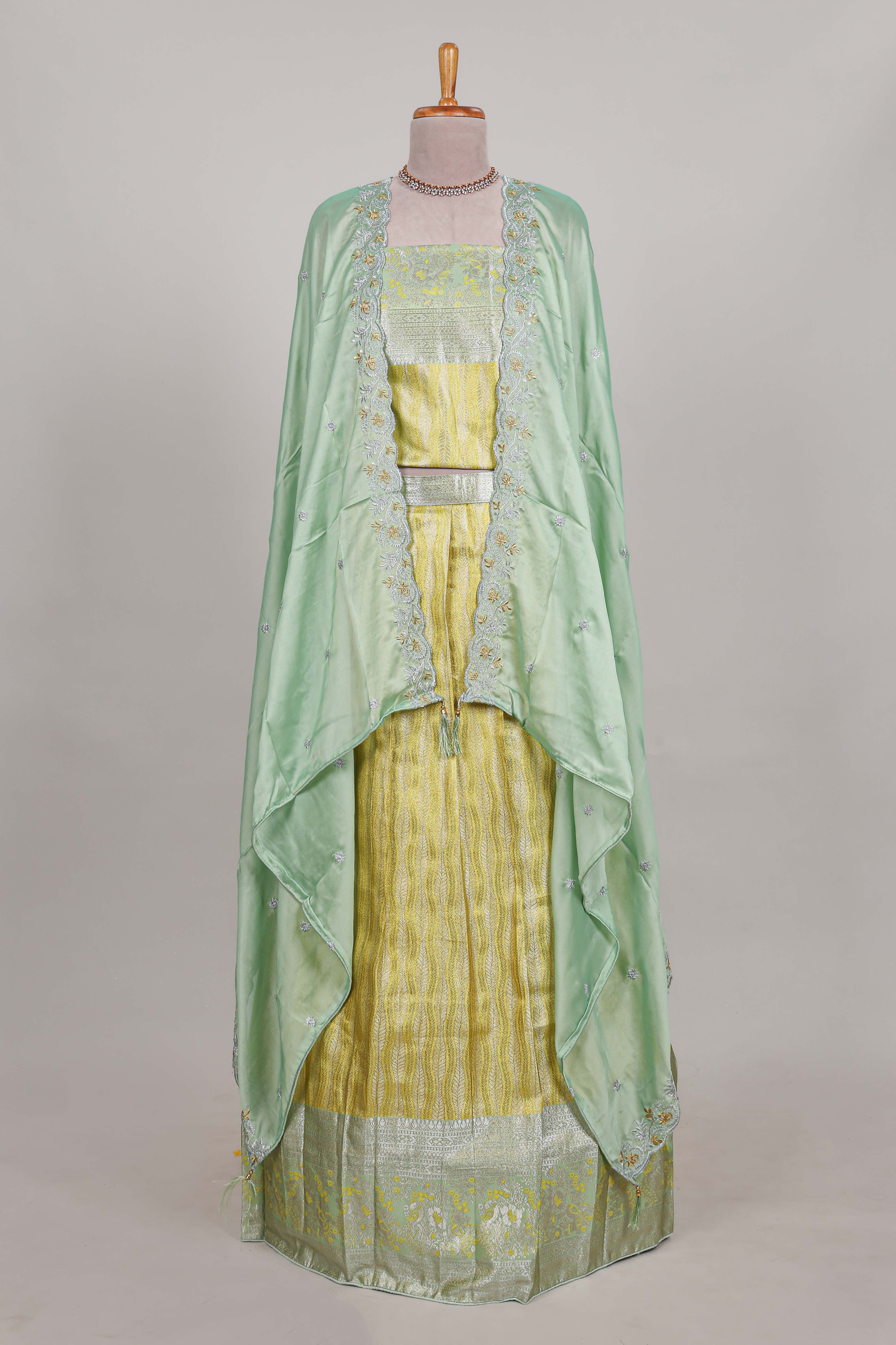 Lemon yellow tissue lehenga featuring elegant vertical line patterns with a beautiful contrast border Paired with a matching shawl
