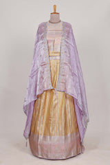 Cream tissue lehenga featuring elegant vertical line patterns with a beautiful contrast border Paired with a matching shawl