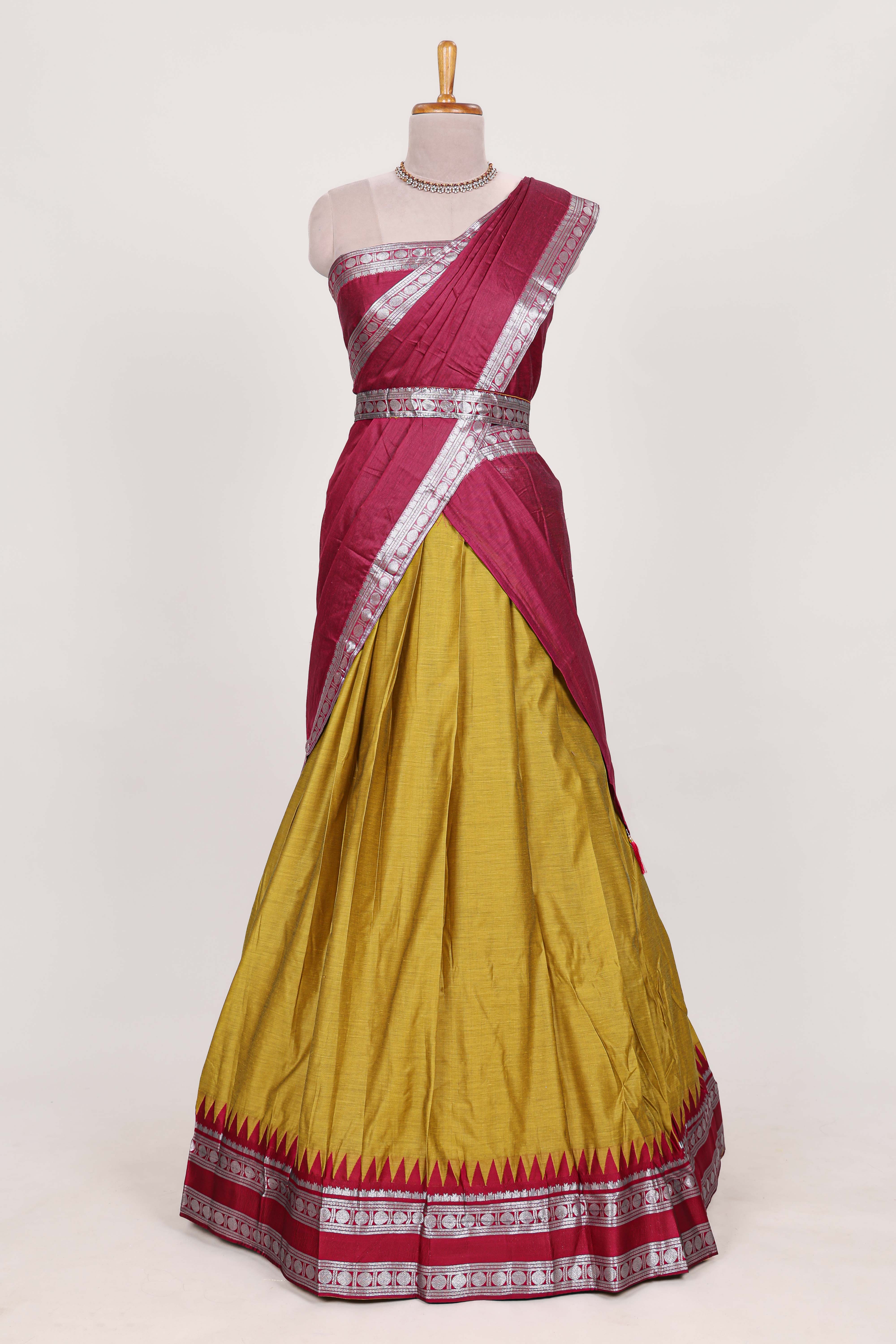 Mustard yellow silk cotton lehenga with a rich maroon shawl with a traditional silver zari woven border and contrast blouse