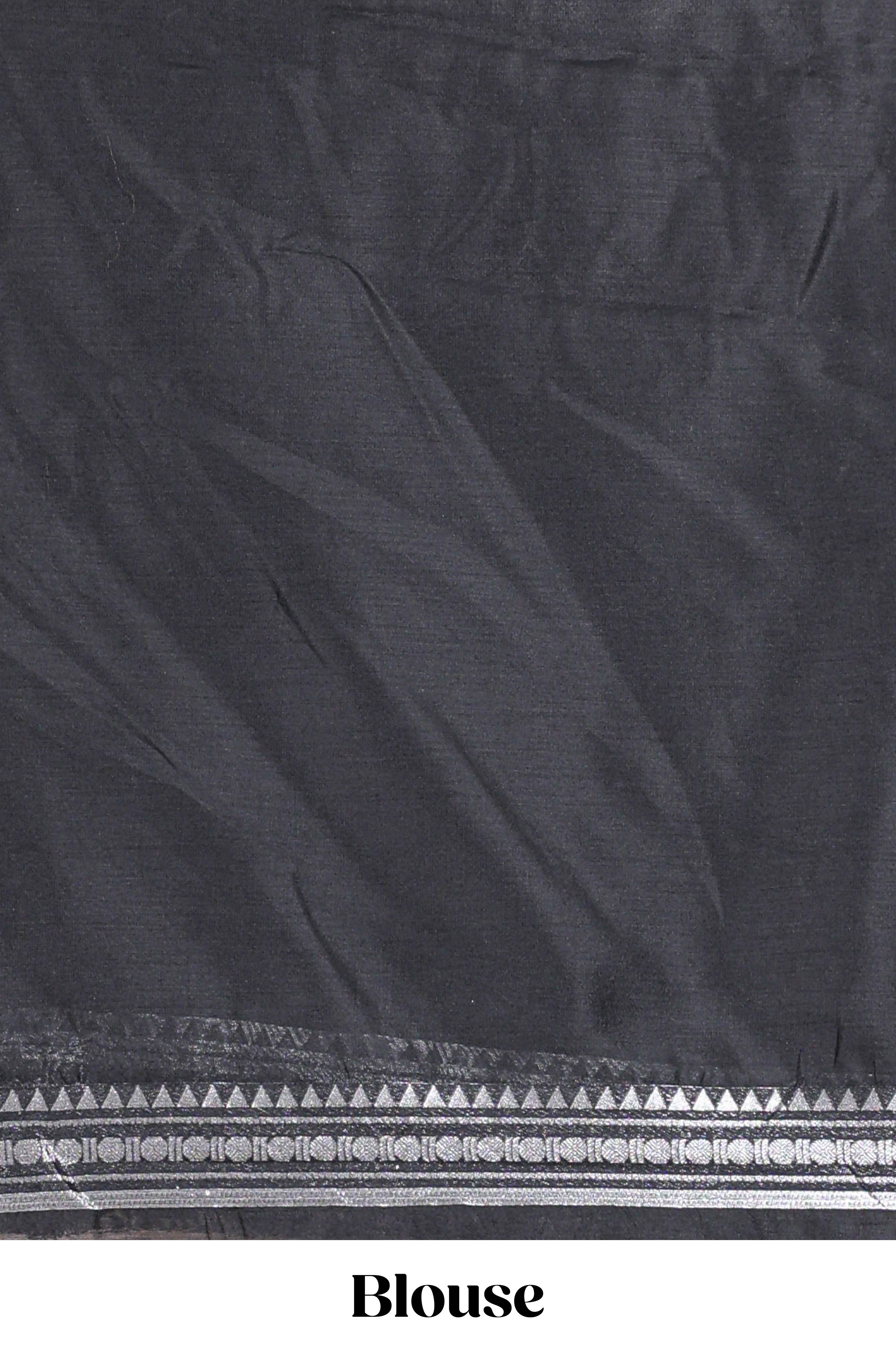 Grey silk cotton lehenga with a black shawl with a traditional silver zari woven border and contrast blouse