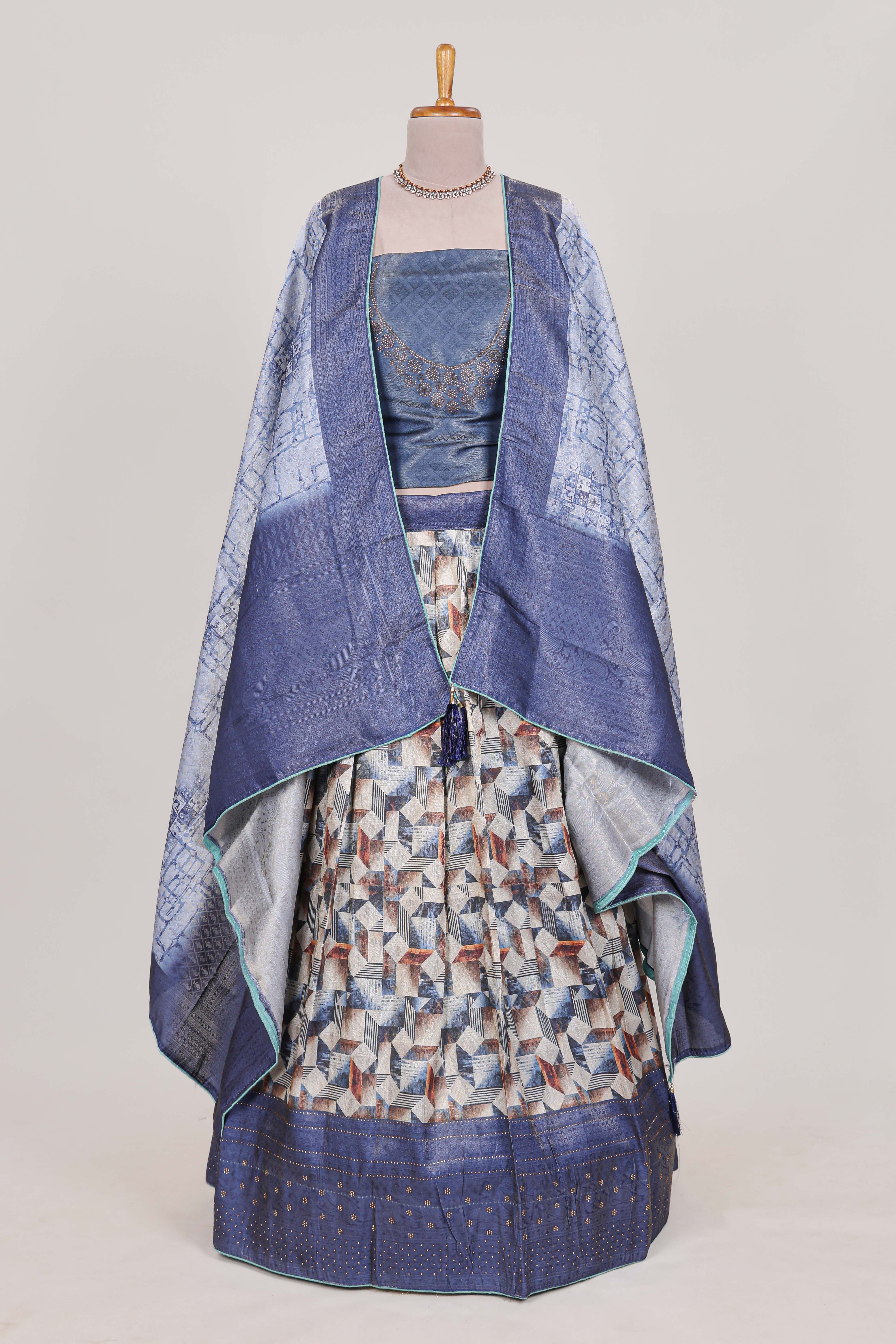 Ocean blue colour eleganttissue lehenga featuring intricate thread weaving details with a beautiful contrast border Paired with a brocadeshawl