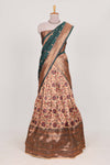 Dark green colour eleganttissue lehenga featuring intricate thread weaving details with a beautiful contrast border Paired with a brocadeshawl