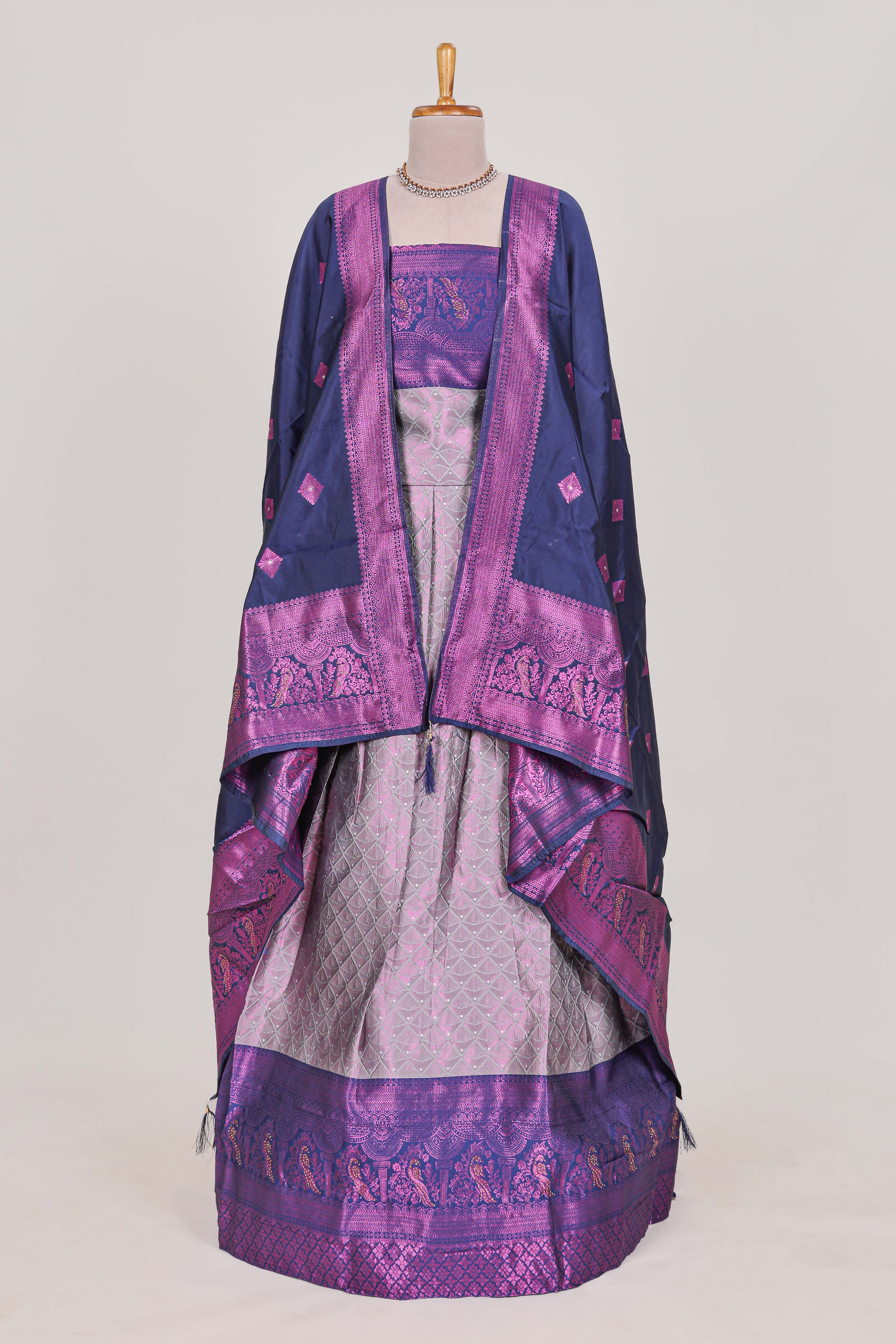 Rich royal purple tissue lehenga featuring intricate thread weaving details with a beautiful contrast border Paired with a brocadeshawl