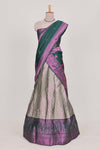Silver tissue lehenga featuring intricate thread weaving details with a beautiful contrast border Paired with a brocadeshawl