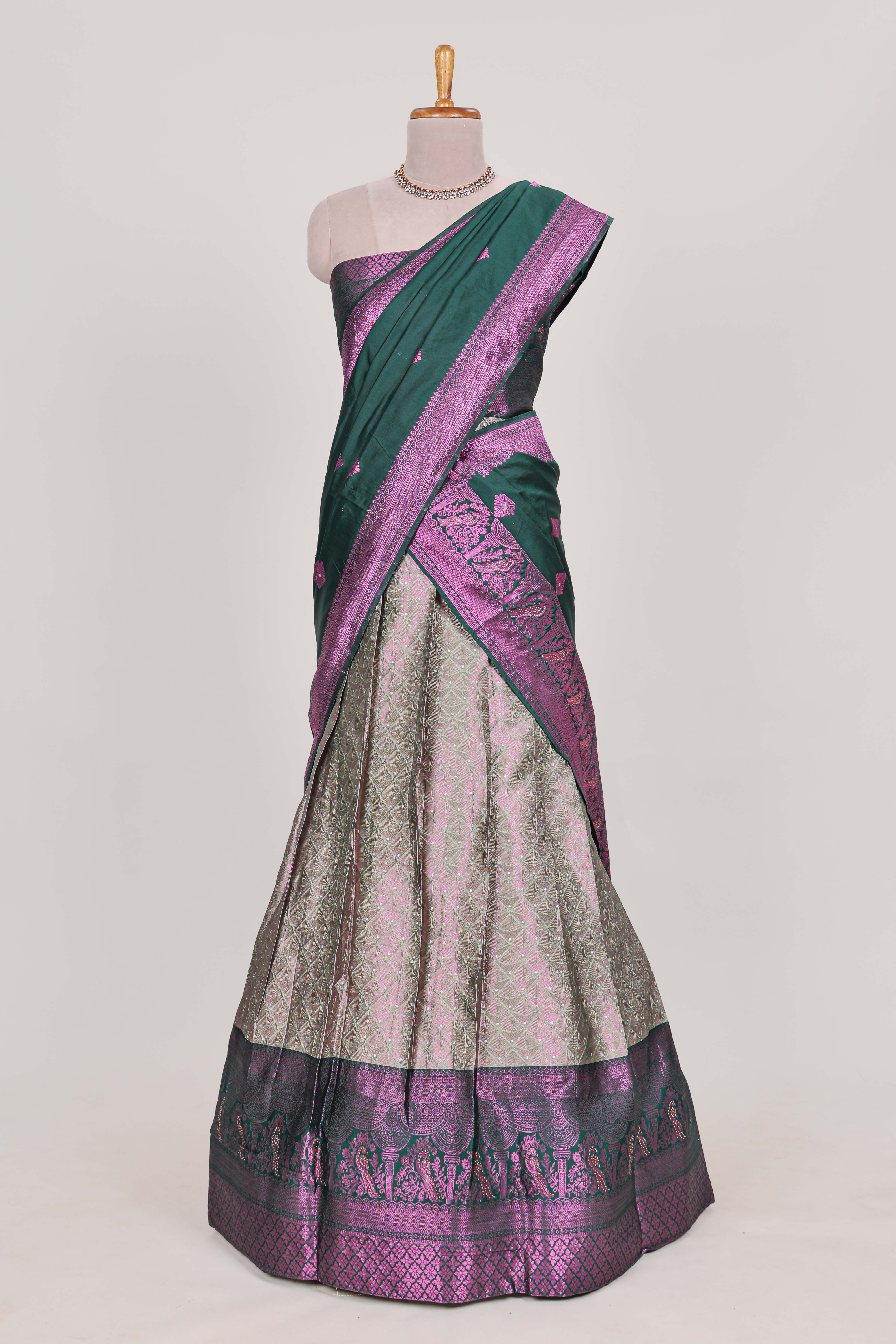 Silver tissue lehenga featuring intricate thread weaving details with a beautiful contrast border Paired with a brocadeshawl
