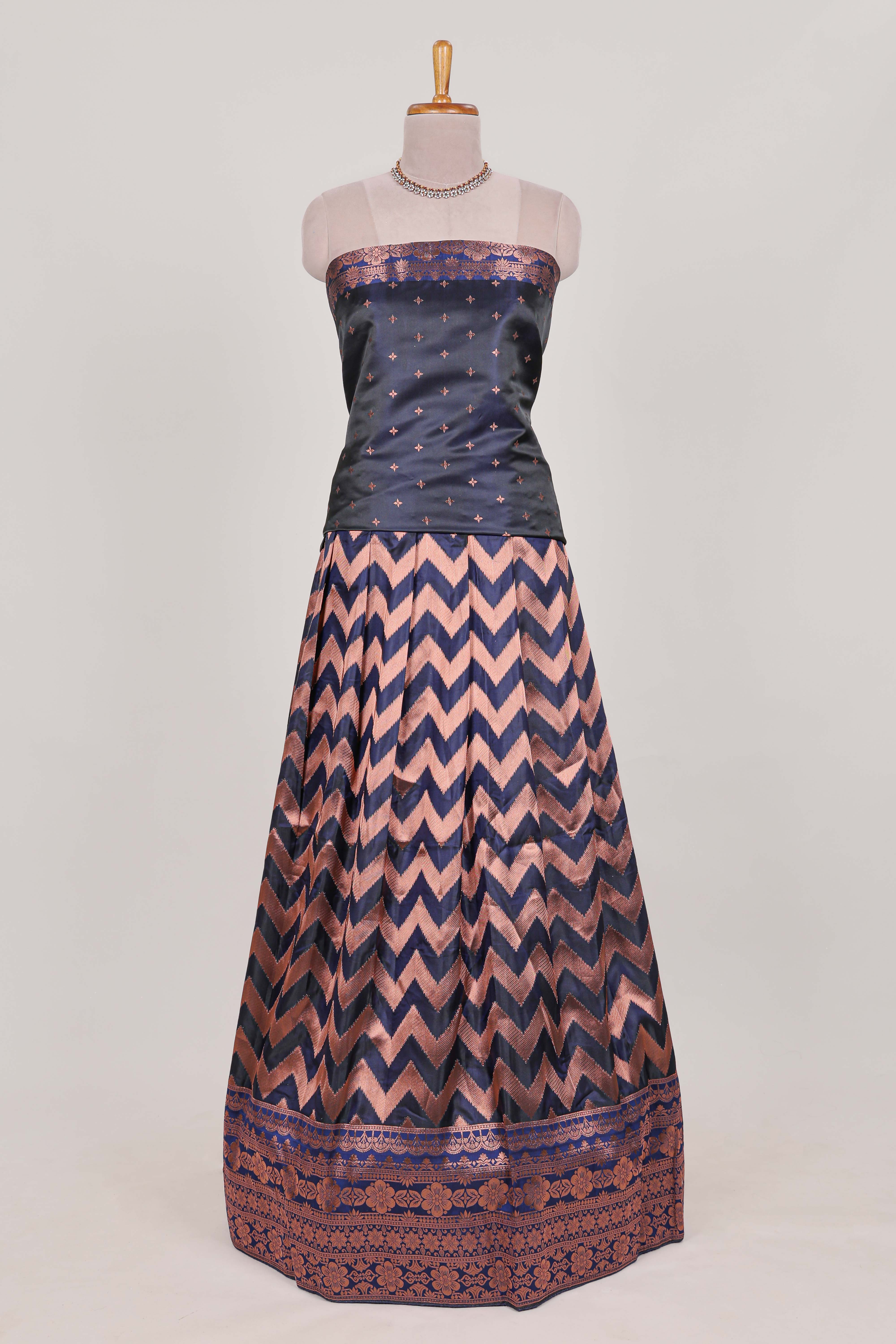 Navy bluelehenga featuring intricate copper thread weaving details with a beautiful contrast border Paired with a brocadeshawl