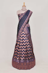 Navy bluelehenga featuring intricate copper thread weaving details with a beautiful contrast border Paired with a brocadeshawl