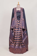 Navy bluelehenga featuring intricate copper thread weaving details with a beautiful contrast border Paired with a brocadeshawl