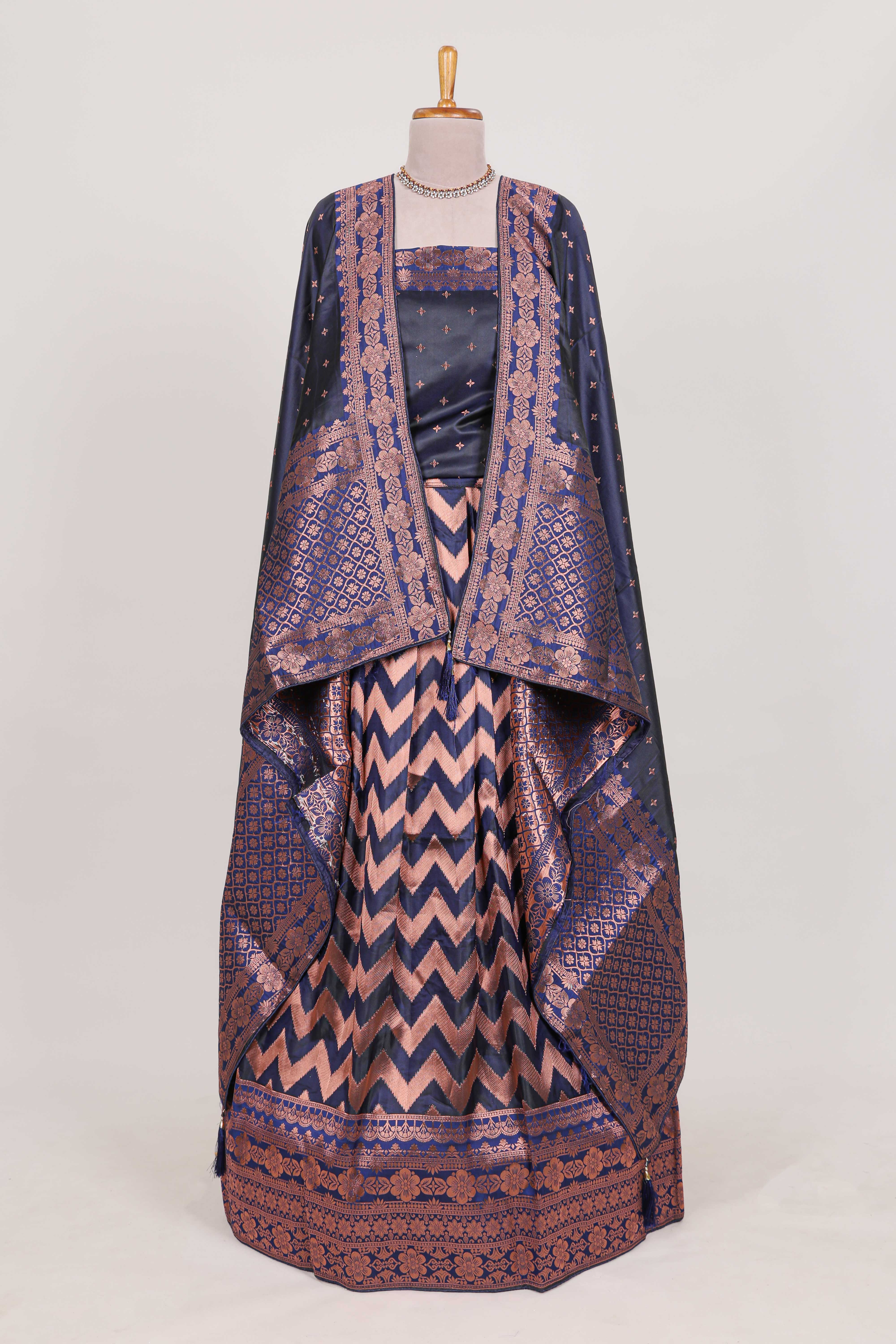 Navy bluelehenga featuring intricate copper thread weaving details with a beautiful contrast border Paired with a brocadeshawl