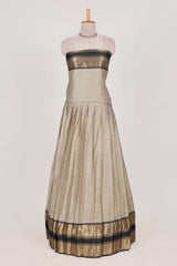 Beige and Black Cotton Half Saree with Gold Zari Border Traditional Embroidery and Elegant Tassel Detailing