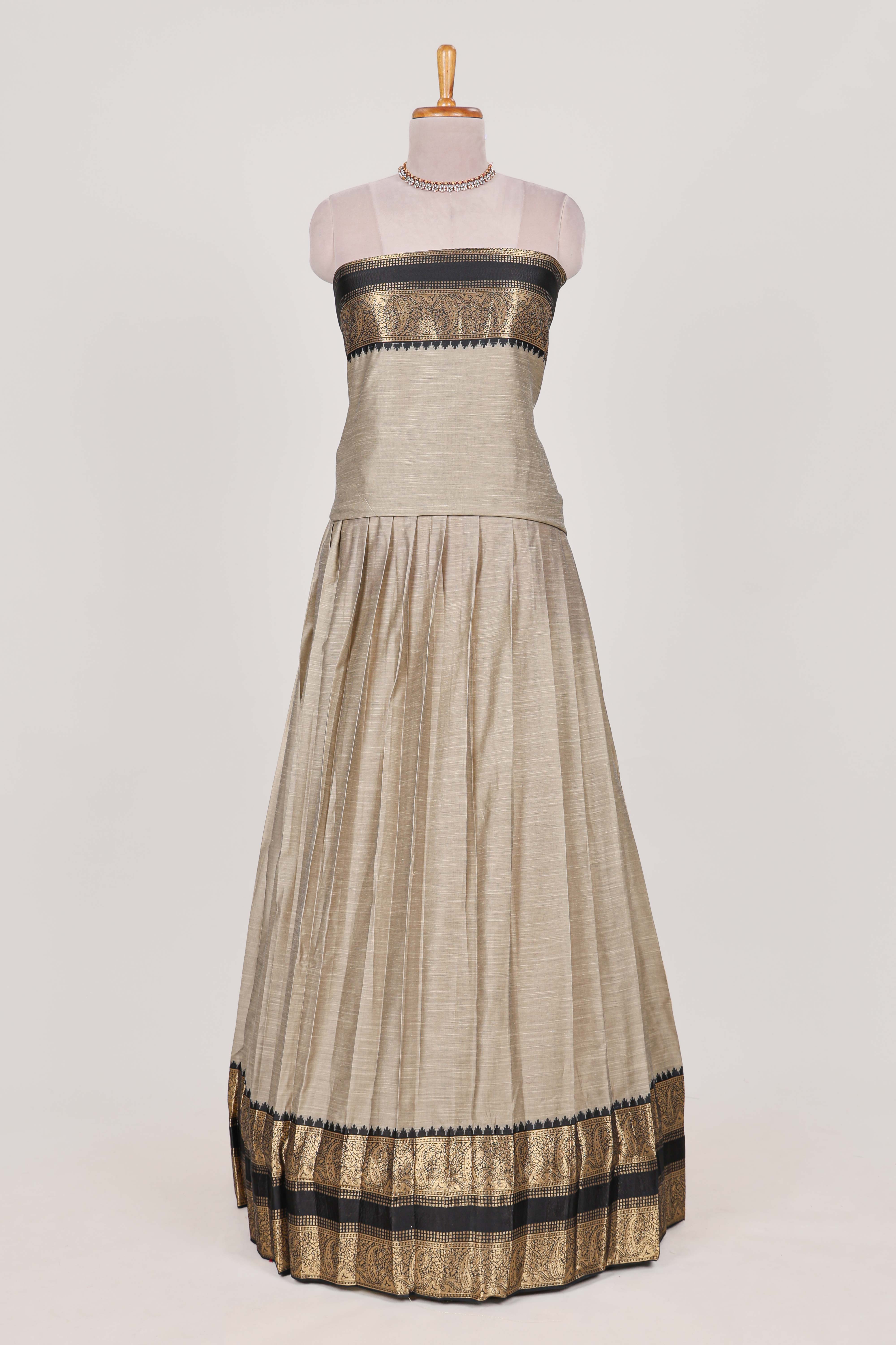 Beige and Black Cotton Half Saree with Gold Zari Border Traditional Embroidery and Elegant Tassel Detailing