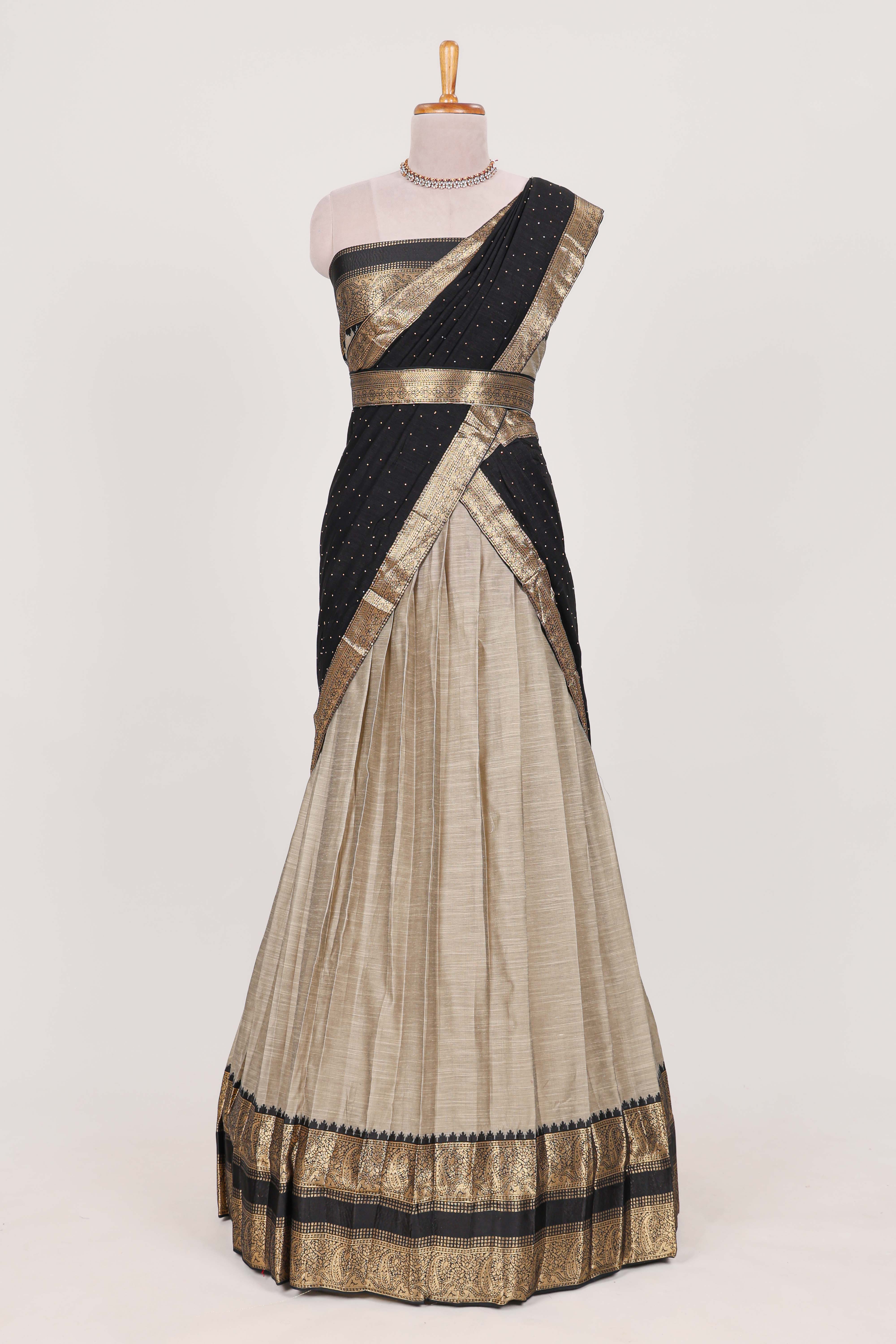 Beige and Black Cotton Half Saree with Gold Zari Border Traditional Embroidery and Elegant Tassel Detailing