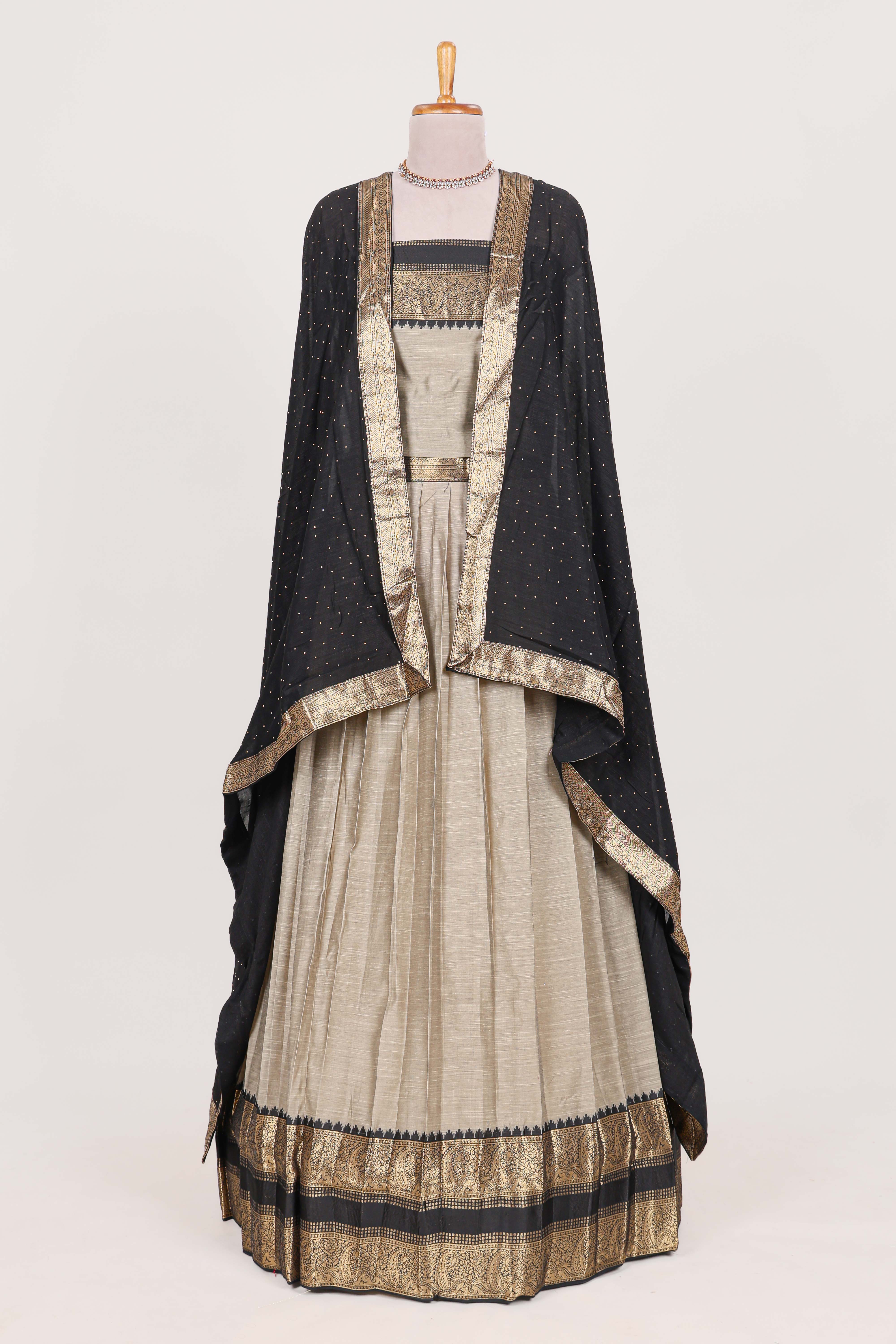 Beige and Black Cotton Half Saree with Gold Zari Border Traditional Embroidery and Elegant Tassel Detailing