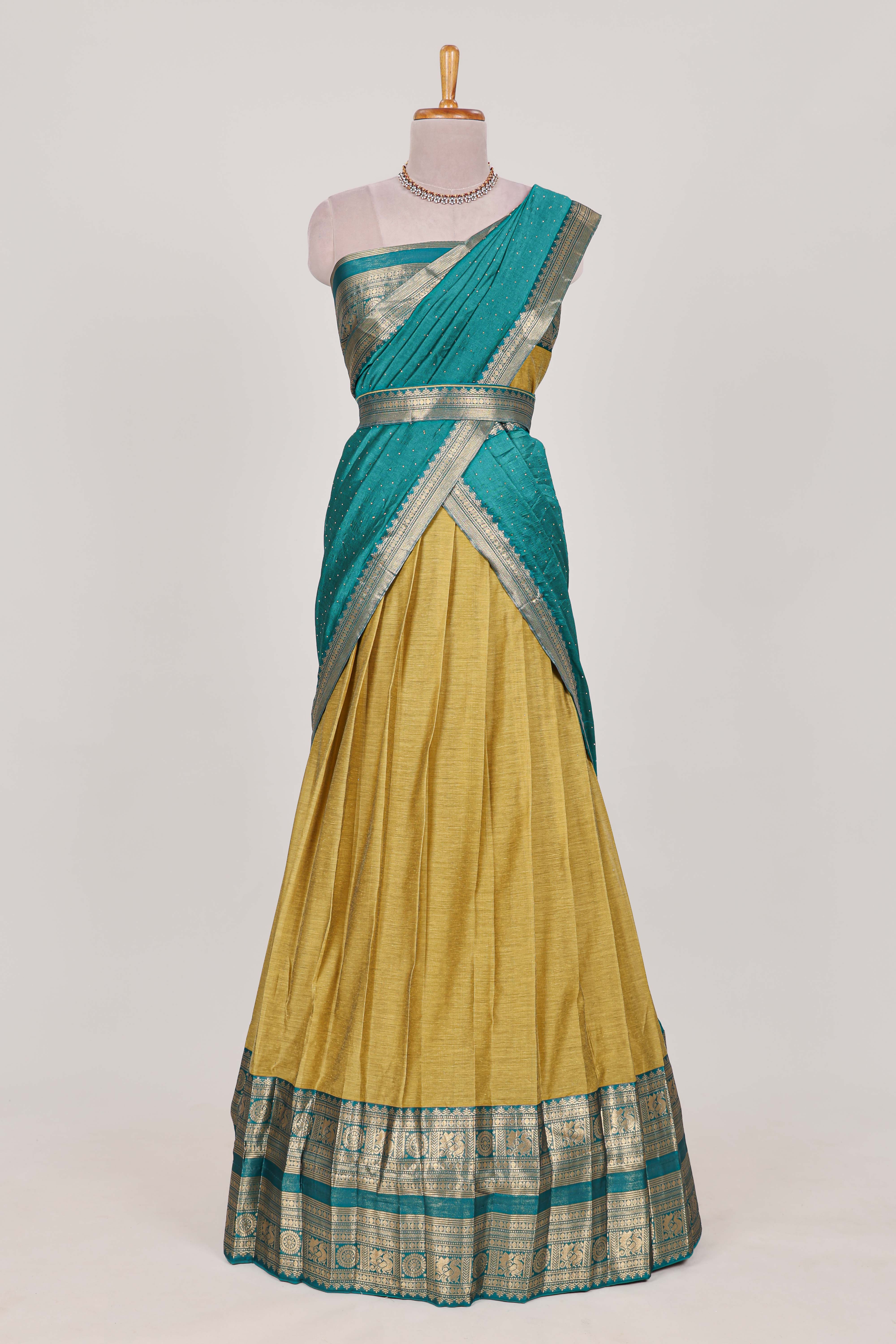 Golden Green Cotton Half Saree with Gold Zari Border Traditional Embroidery and Elegant Tassel Detailing