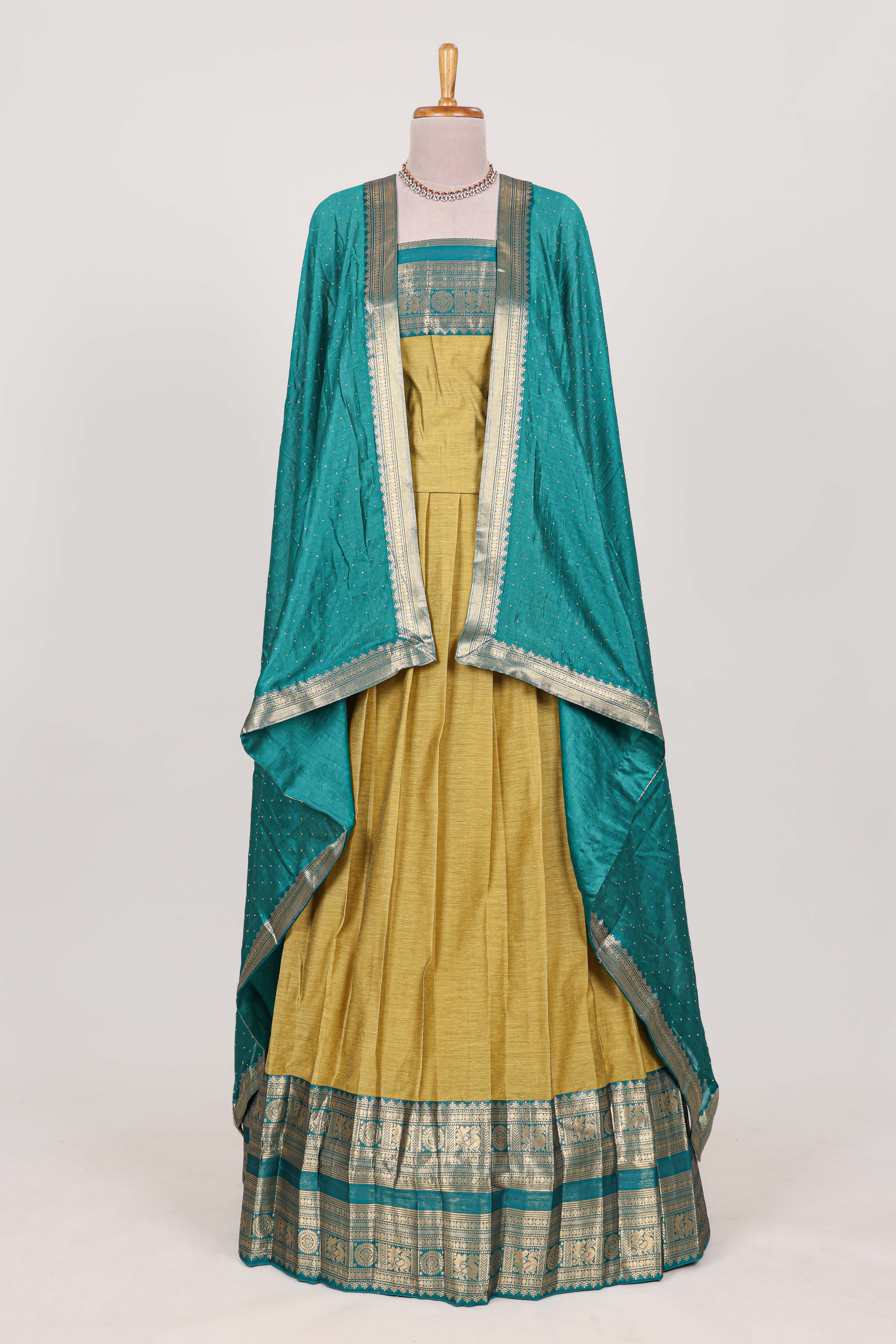 Golden Green Cotton Half Saree with Gold Zari Border Traditional Embroidery and Elegant Tassel Detailing