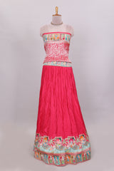 Rani pink plain lehenga featuring with human figure motifs with floral and ornamental detailing border Paired with a teal blue floral designedshawl