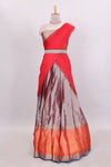 Lavender floral zari lehenga featuring contrasting bentex border Paired with plain red shawl with stone work
