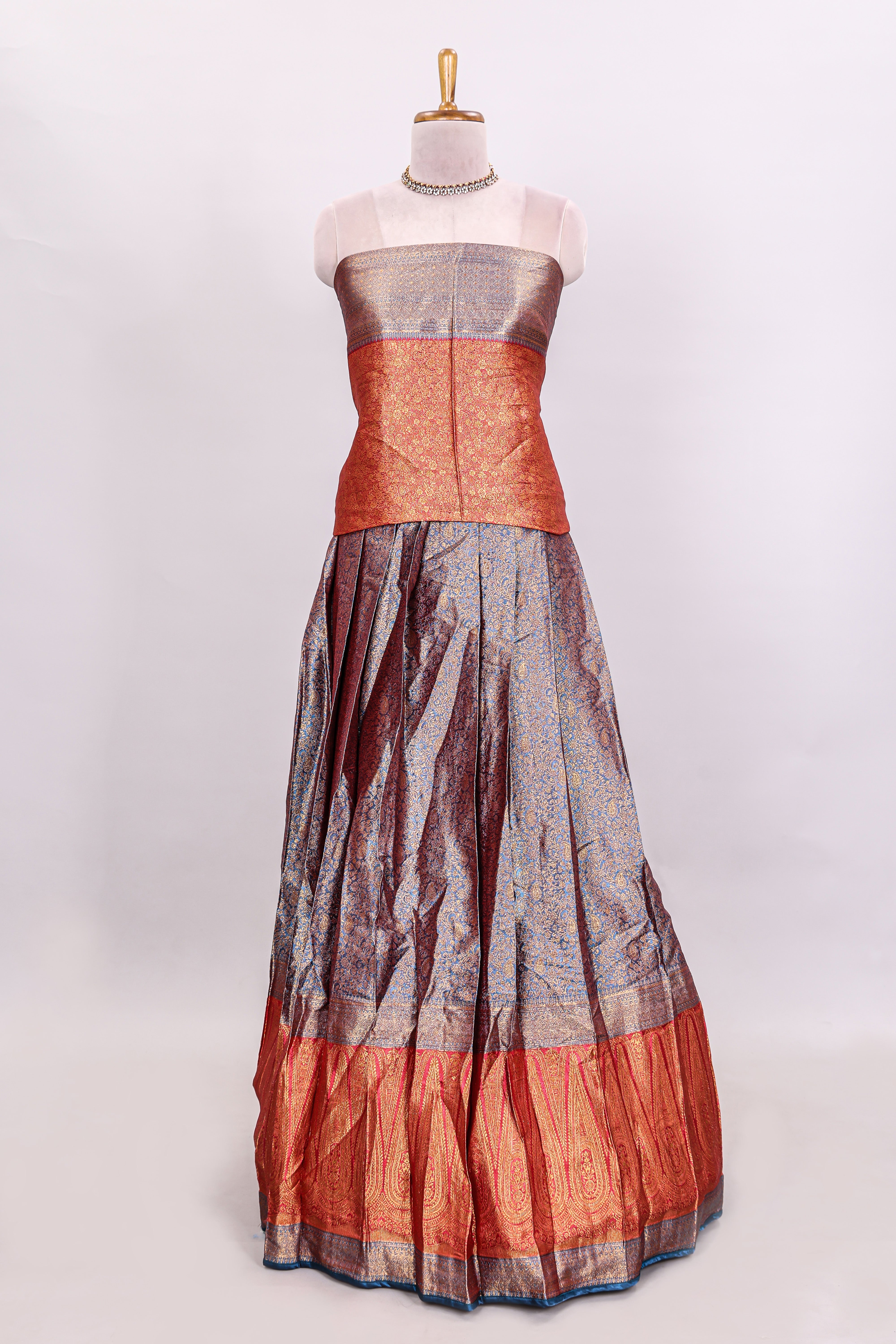 Lavender floral zari lehenga featuring contrasting bentex border Paired with plain red shawl with stone work