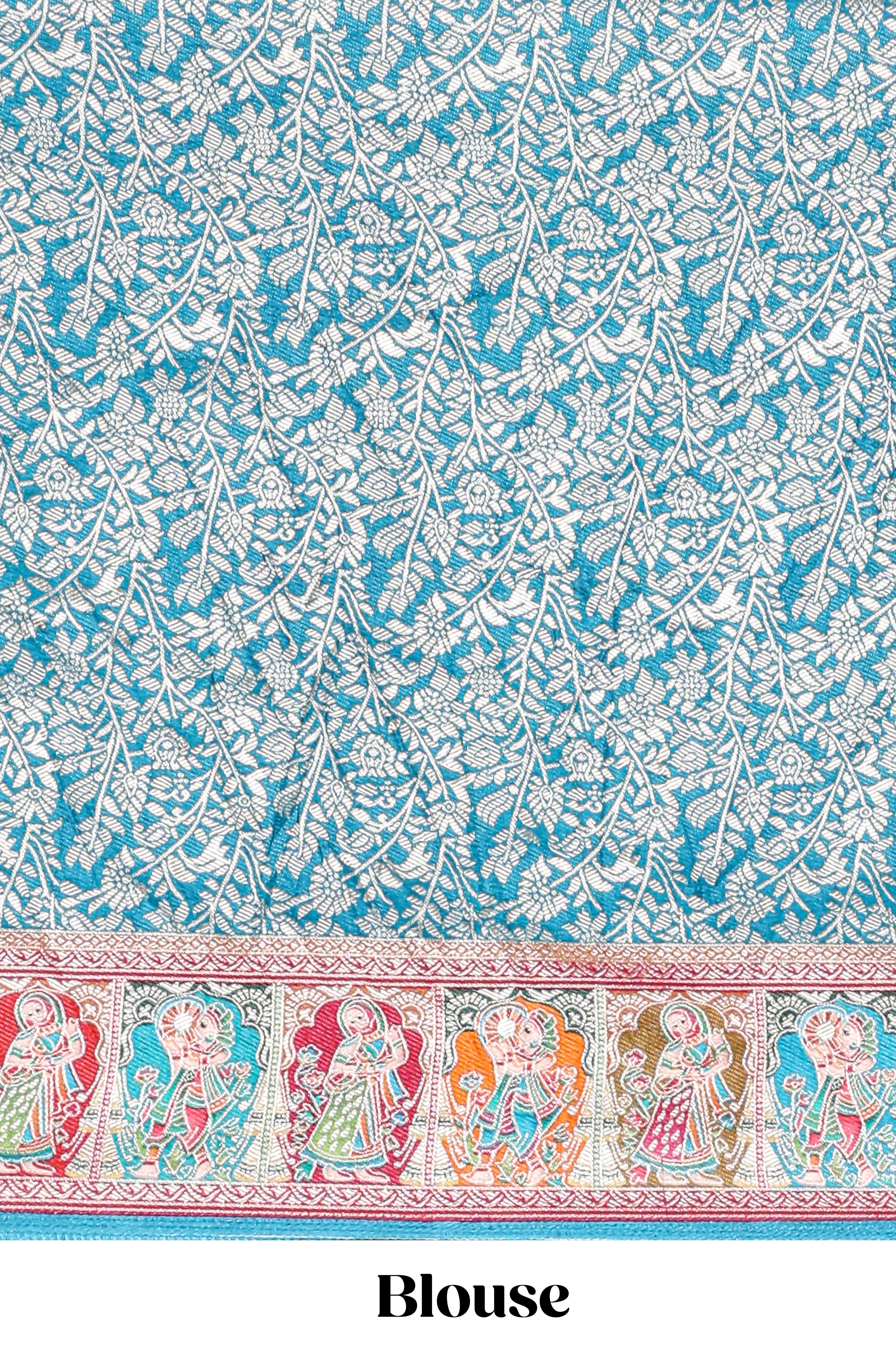 Blue plain lehenga featuring with human figure motifs with floral and ornamental detailing border Paired with a pink floral designedshawl