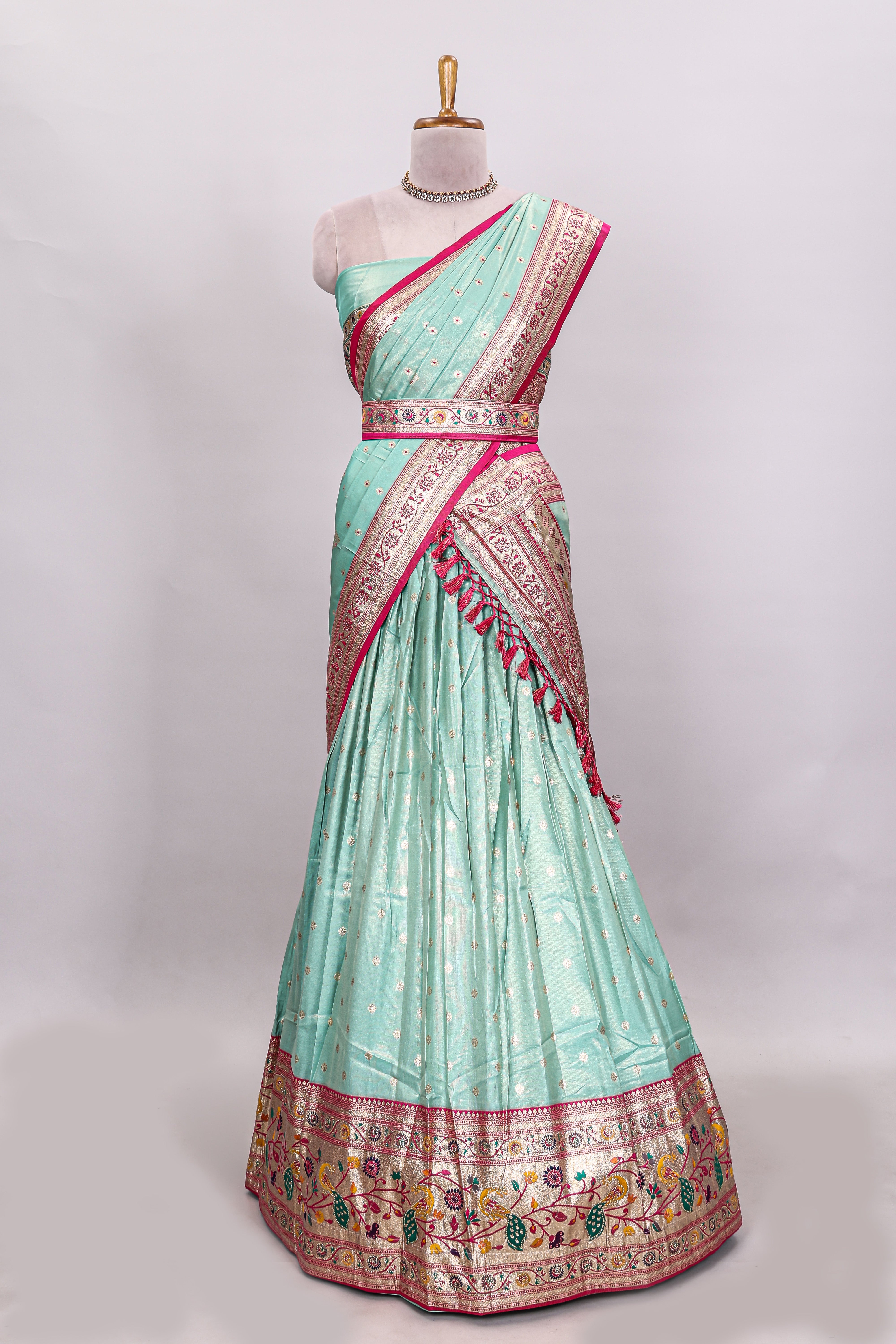 Pista green butta designed lehanga with contrast floral design border and contrast blouse paired with matching floral butta motifs shawl