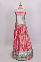 Peach butta designed lehanga with contrast floral design border and contrast blouse paired with matching floral butta motifs shawl