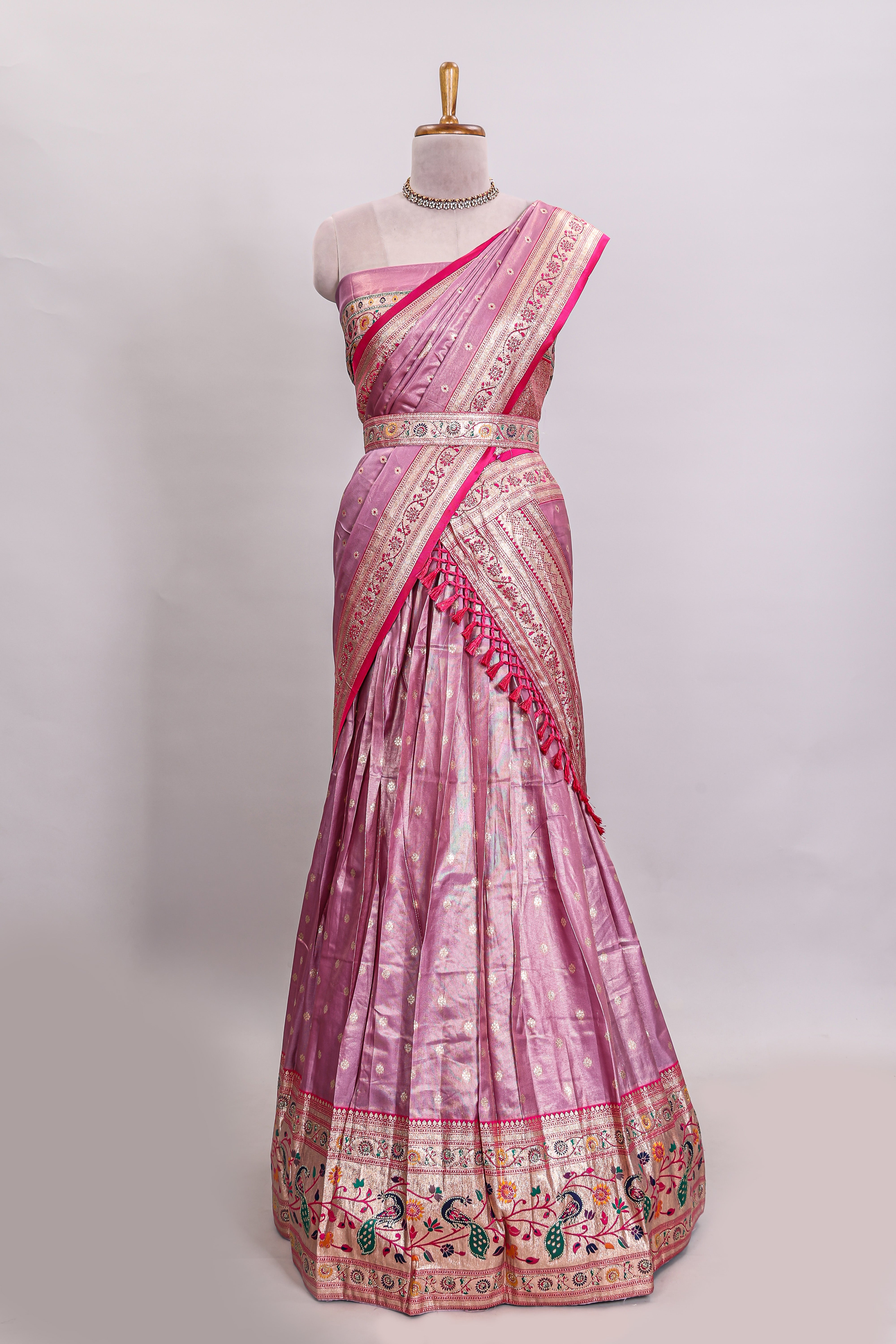 Pink butta designed lehanga with contrast floral design border and contrast blouse paired with matching floral butta motifs shawl