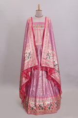 Pink butta designed lehanga with contrast floral design border and contrast blouse paired with matching floral butta motifs shawl