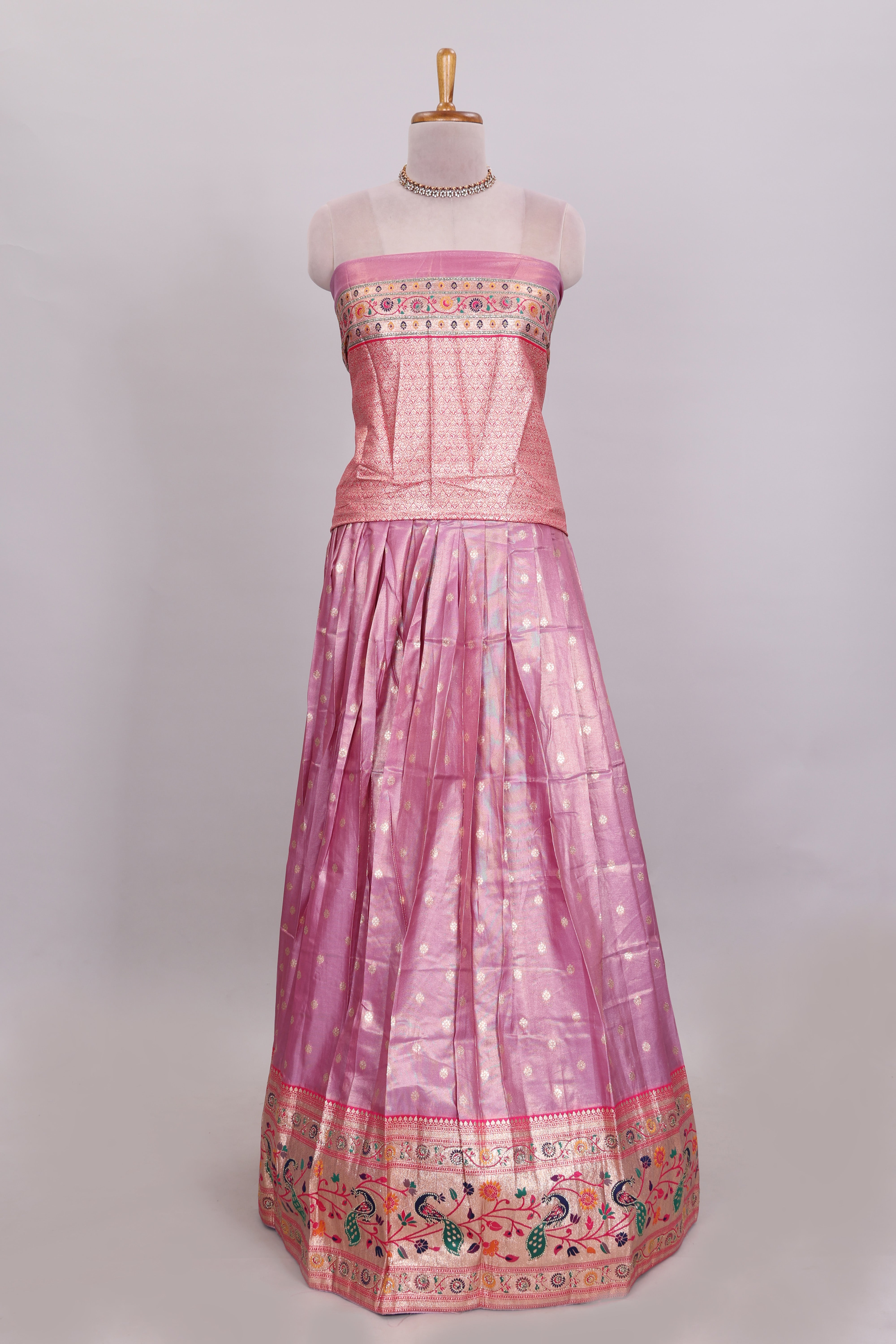 Pink butta designed lehanga with contrast floral design border and contrast blouse paired with matching floral butta motifs shawl