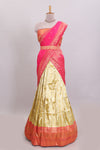 Ivory gold shade geometric zari lehanga featuring contrast border and matching blouse paired with contrast pink shawl