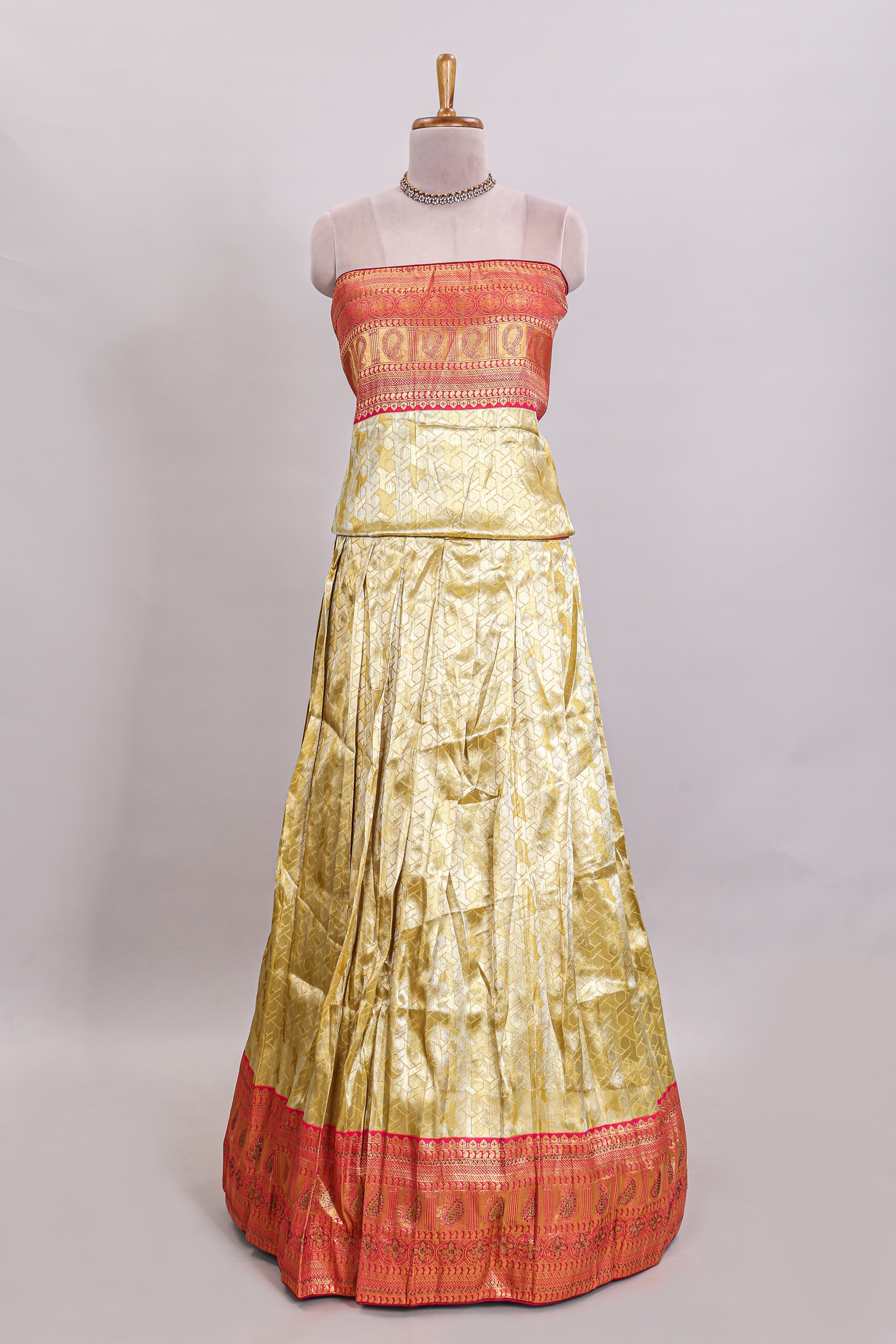Ivory gold shade geometric zari lehanga featuring contrast border and matching blouse paired with contrast pink shawl