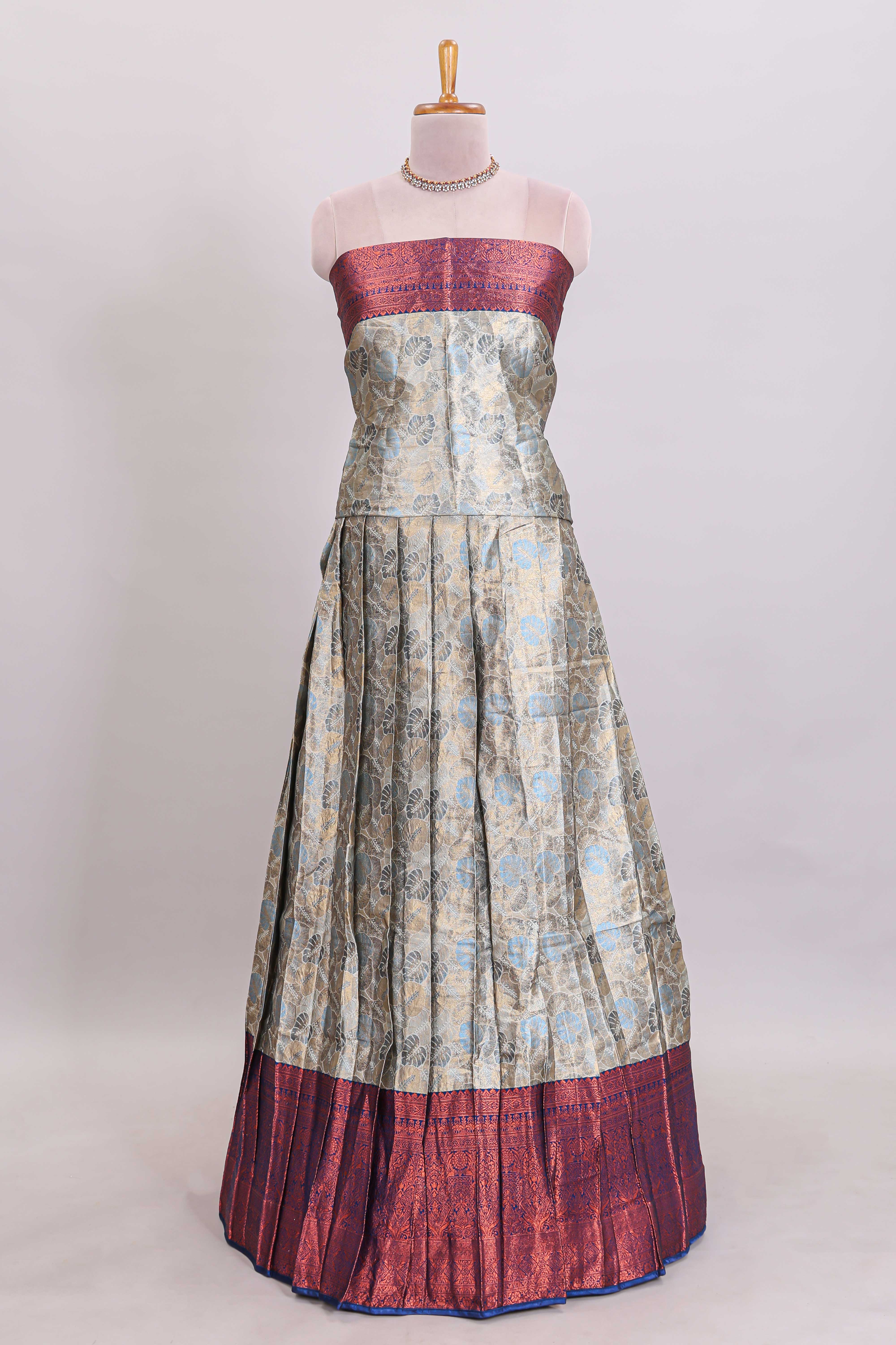 Antique ivory unique designed lehanga featuring contrasting border and matching blouse paired with contrast navy blue shawl