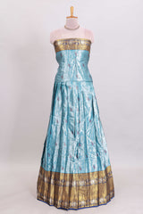 Light blue shade manga motifs lehanga featuring contrasting zari border and matching blouse paired withnavy blue organza shawl