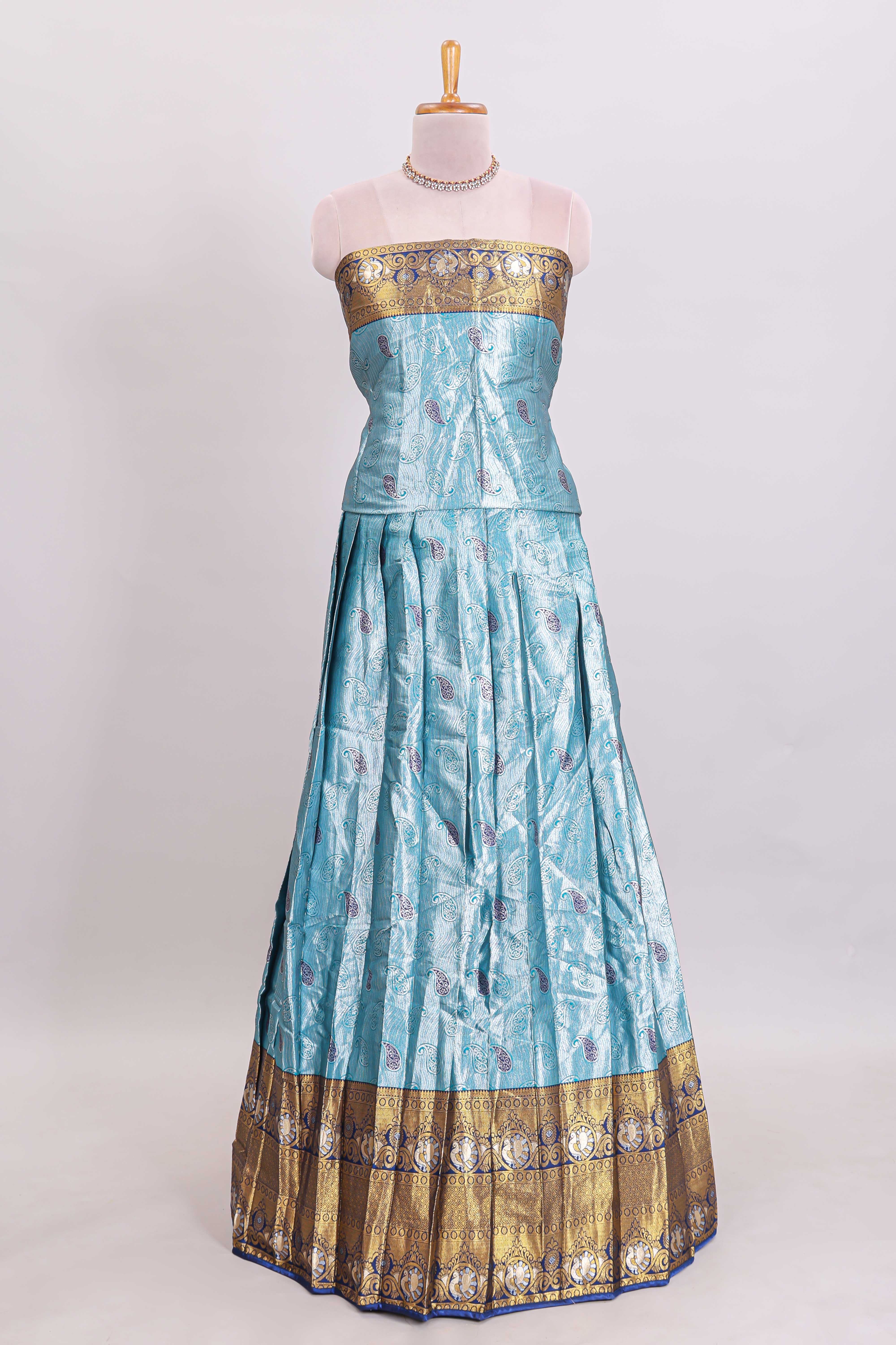 Light blue shade manga motifs lehanga featuring contrasting zari border and matching blouse paired withnavy blue organza shawl