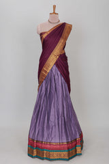 Lavender shade plain lehanga featuring contrasting zari border and blouse paired withmaroonshawl