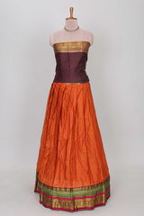Orange shade plain lehanga featuring contrasting zari border and blouse paired with brown shawl