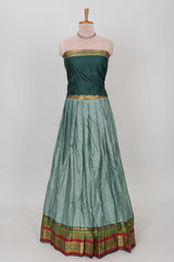 Green shade plain lehanga featuring contrasting zari border and blouse paired with pine green shawl