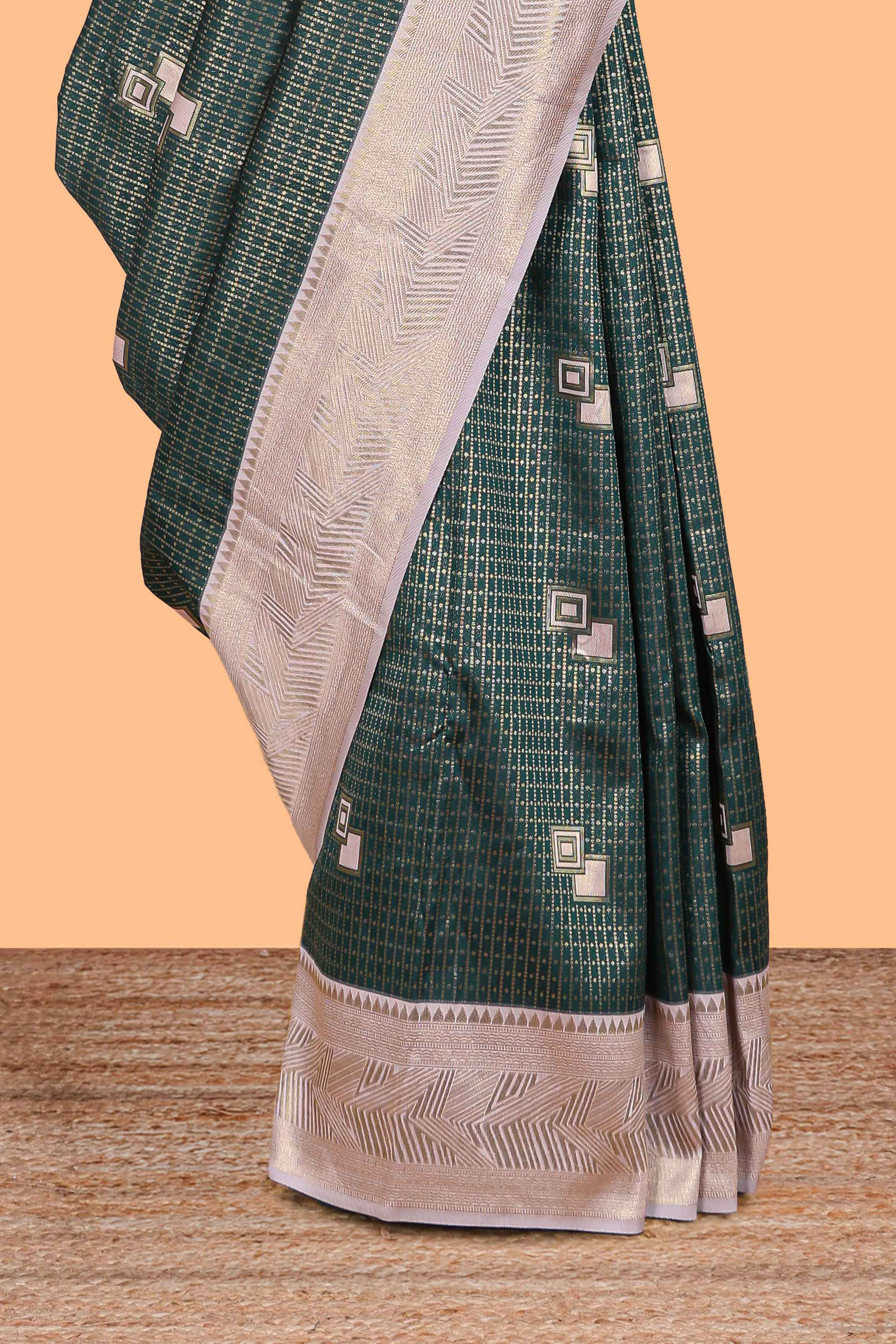 Green checked geometric design litchi silk saree with contrast zari border and blouse
