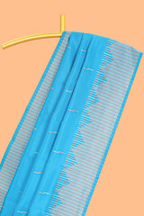 Blue geometric style motifs litchi silk saree with contrast striped border and blouse
