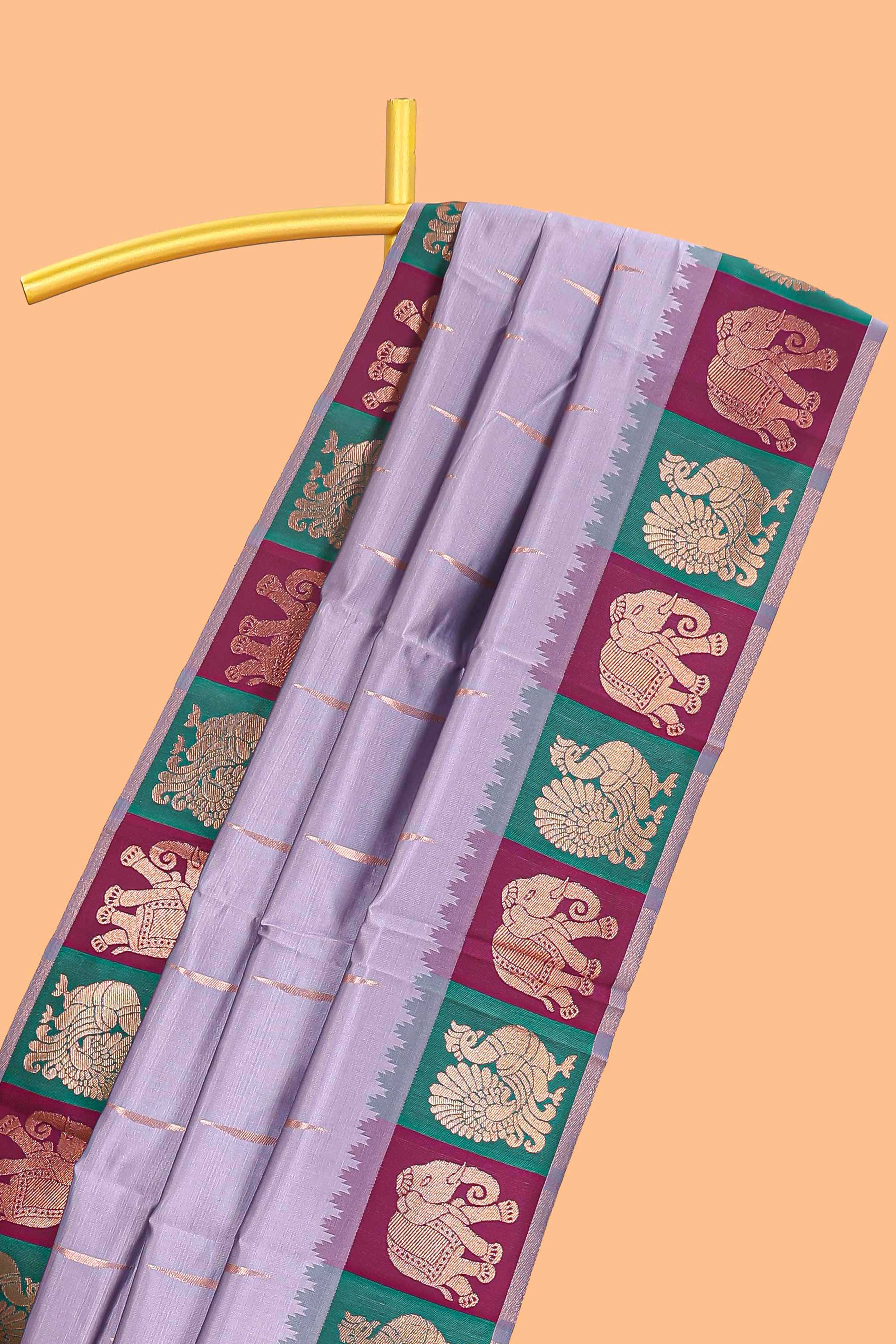 Lavender litchi silk saree with contrast elephant & peacock zari border and blouse