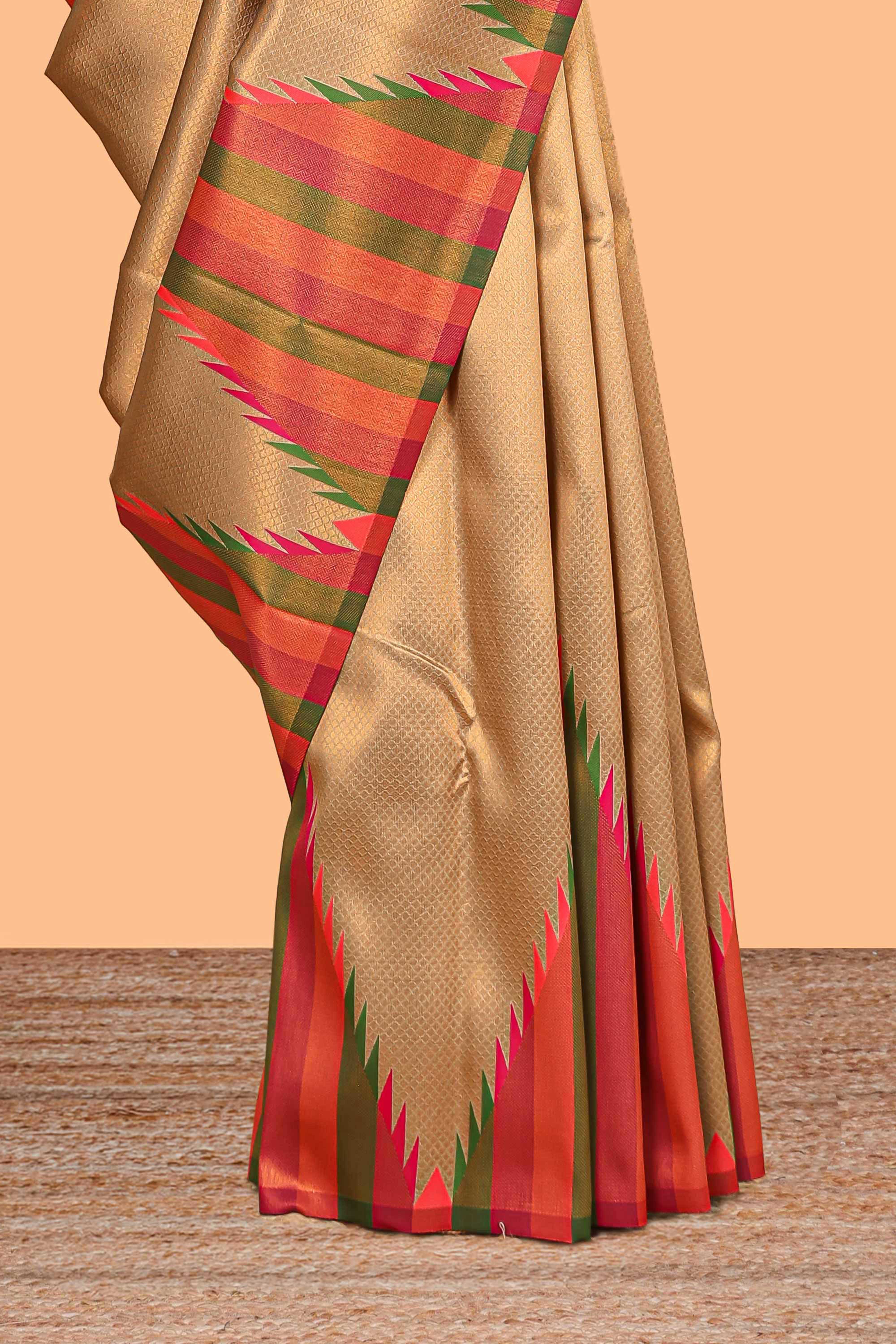 Golden plain litchi silk saree with contrast multi color ikkat style border and blouse