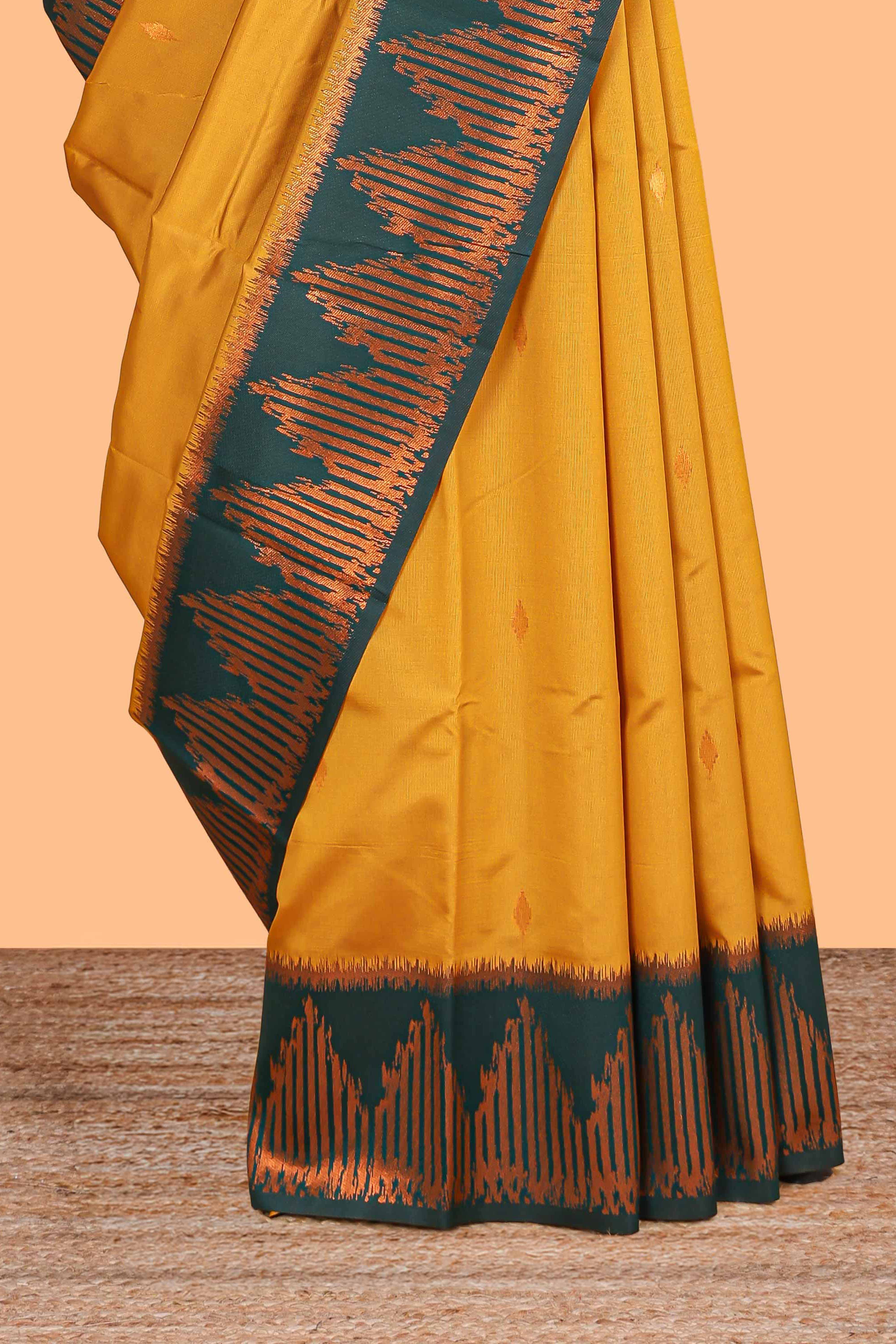 Golden yellow zari butta litchi silk saree with contrast zari border and blouse